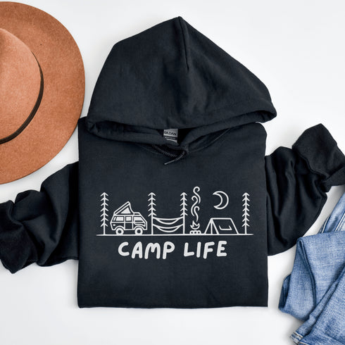 Introducing the ultimate companion for your outdoor adventures: the Camp Life Hoodie. Designed for those who find solace under the stars and joy by the campfire, this hoodie encapsulates the essence of camping. Featuring a picturesque camping scene that speaks directly to the heart of outdoor enthusiasts
